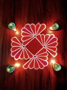 an image of a decorated table with candles and lights on it for diwaling