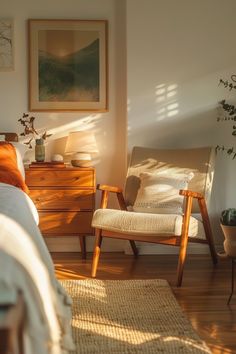 a bedroom scene with focus on the bed and chair in the foreground, sunlight streaming through the window