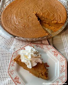 a piece of pie on a plate next to the pie