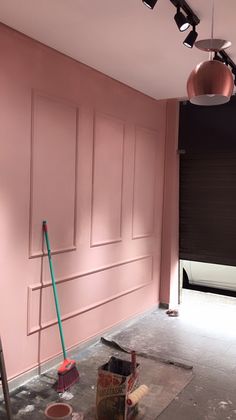 the room is being painted pink and ready to be used as a tv studio area