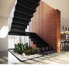 a brick wall and stairs in a modern house