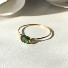 Please note: Shade of green and/or size & shape may vary slightly due to nature of the stone. This beautifully simple ring is lovingly handmade with a rectangle Tourmaline stone and a choice of 14k Gold Filled, 14k Rose Gold Filled or Sterling Silver band. M A T E R I A L S: * Green Tourmaline * 14k Gold Filled, 14k Rose Gold Filled or Sterling Silver S I Z E: *  Gemstone - Approximately 4-6mm *  Band Thickness - Approximately 0.8-1mm  All of our jewellery is carefully handmade using good quality materials and handpicked gemstones, with the aim to produce quality pieces that you can love & wear for years to come.  T O U R M A L I N E: * October Birthstone * Talisman for Capricorn, Aries, Virgo & Libra  * Heart Chakra Tourmaline aids in understanding oneself and others.  It promotes self-co Silver Wire Rings Handmade, Handmade Rings Wire Simple, Rings From Wire, How To Make Rings Out Of Wire, Wire Wrap Rings, Diy Wire Jewelry Rings, Silver Wire Rings, Wire Wrap Ring, Jewellery Wire