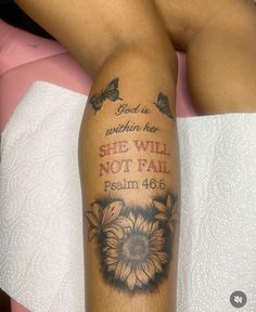 a woman's leg with a tattoo saying god is within her she will not fail