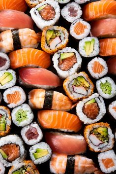 assorted sushi rolls with different toppings and sauce on them stock photo - 787