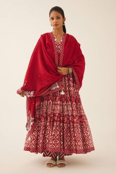 Red cotton chanderi tiered anarkali with floral hand block print and sequin, tassel, bead work on yoke. Paired with cotton slip, hand block printed straight pant and silk chanderi dupatta with printed border on the edges.
Components: 4
Pattern: Hand Block Printed, Embroidery
Type Of Work: Floral, sequin, bead, tassel
Neckline: Notched
Sleeve Type: Three quarter
Fabric: Anarkali: Cotton Chanderi, Slip and Pant: Cotton, Dupatta: Silk Chanderi
Color: Red
Other Details: 
Elasticated waist at the bac Tiered Anarkali, Red Anarkali, Chanderi Dupatta, Printed Embroidery, Cotton Slip, Cotton Dupatta, Hand Block Print, Straight Pants, Set For Women