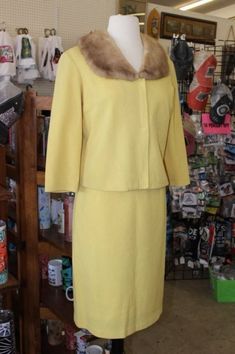 "Yellow knit pencil skirt with 26\" waist, 36\" hips, closure is zipper with button on waist band. Jacket is sleek with 38\" bust, sleeve width of 12\", sleeve length of 18\".  Snap fasteners down the front. And a fur collar that is not detachable. Material is a very fine knit with a rayon backing. No pockets." Ducky Momo, Band Jacket, Marcasite Earrings, Womens Suits, Knit Pencil Skirt, Yellow Knit, Pencil Skirts, Snap Fasteners, Fur Collar