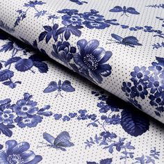 blue flowers and butterflies on white fabric