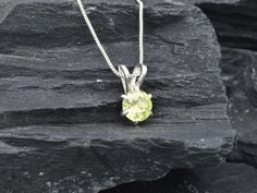 Green Peridot Pendant set with a Natural Peridot in a perfect diamond cut, flawless clarity & vivid green color at 7mm (1 Ct) from Brazil,. Solid 925 Sterling Silver ☞ made to last. Matching Ring & Earrings ☞ please ask meDetails:• Natural Peridot sourced from Brazil• Peridot: 7mm, 1 Ct, round cut• Dimensions: Height 13mm, Width 7mm• Free Complimentary Chain• Solid 925 Sterling Silver❀ Each Natural Gem is unique & will have Slight variations from the product pictures "no two Natural Stones are a Formal Yellow Solitaire Jewelry, Green Peridot Jewelry With Prong Setting, Green Gemstone Necklace With Round Cut, Green Gemstone Round Cut Necklace, Peridot Gemstones Gift, Elegant Round Peridot Stone Jewelry, Elegant Peridot Jewelry With Prong Setting, Elegant Peridot Round Jewelry, Elegant Lime Green Diamond Jewelry