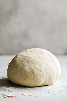 a ball of dough sitting on top of a table