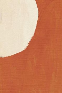 an orange and white painting with a large circle on the top of it's surface