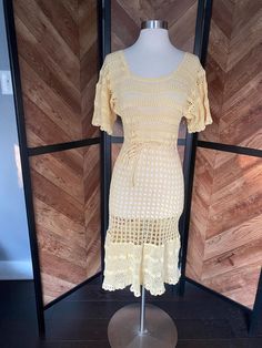 Fabulous 1930's butter yellow crochet flutter sleeve dress with drawstring waist. Very very good vintage condition, but has two fait pink spots on the booty.  Women's medium Measurements coming Vintage Fitted Crochet Dress For Spring, Vintage Lace Crochet Dress For Spring, Vintage Fitted Crochet Dress With Lace Trim, Fitted Vintage Crochet Dress With Lace Trim, Fitted Vintage Crochet Lace Dress, Fitted Retro Crochet Dress For Spring, Fitted Retro Crochet Dress For The Beach, Retro Fitted Crochet Dress For Beach, Fitted Yellow Crochet Dress For Spring