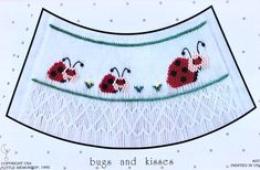 an embroidered skirt with ladybugs on it