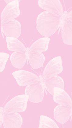 a pink background with white butterflies on it