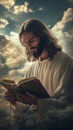 a man with long hair and beard holding an open book in front of cloudy sky