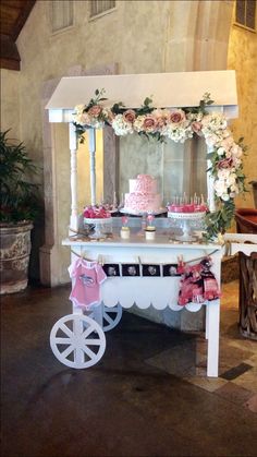 a table with cake and cupcakes on it