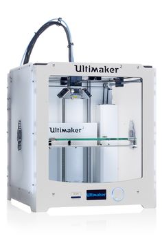 the ulimaker 3d printer is white and has two different parts attached to it