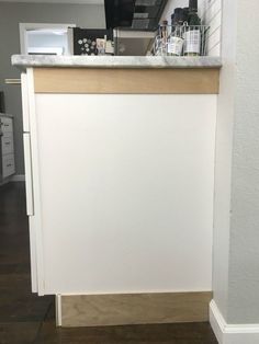 the kitchen counter is clean and ready to be used as a coffee bar or breakfast bar