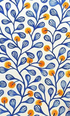 blue and orange leaves on a white wallpaper with an orange dot in the center