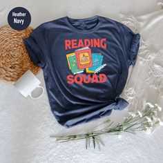 Reading Team Shirt, Book Lovers Shirt, Book Club's Shirt, Students Book Shirt, Reading Squad Shirt Crew Neck Shirt With Text Print, Casual T-shirt For End Of School Year Fan Merchandise, Bookish Crew Neck Shirt With Text Print, Themed Cotton T-shirt With Letter Print, Bookish Crew Neck Top With Character Print, Bookish Crew Neck T-shirt With Funny Print, Bookish T-shirt With Funny Print And Short Sleeves, Bookish T-shirt With Funny Print For School, Casual School Shirt With Character Print