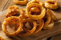 onion rings on a wooden cutting board ready to be eaten