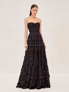 The Ottilie Dress is a vision in lace, featuring a strapless bodice that flows into layers of delicate, tiered lace. Each ruffle adds a touch of romance, making it a stunning choice for any event. Ruffle Tiered Dress, Ruffle Prom Dress, Black Bridesmaid Dresses, Black Sheath Dress, Midi Sheath Dress, Silk Midi Dress, Lace Dress Black, Layer Dress, Red Midi Dress