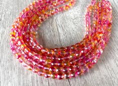 A gorgeous beaded statement necklace made with pink and orange faceted crystal beads.  - 6 strands (more are listed) - Shortest strand measures 18.75 - 20.75"   - Gold Stainless steel lobster claw (sterling silver, gold filled, stainless steel are also available)   - 2" gold stainless steel extender chain - Lead free pewter multi strand connector The necklace length can also be customized. The mannequin's neck size is 14.5" for your reference.  More colors: https://www.etsy.com/shop/DanaLeBlancD Pink Faceted Round Bead Necklaces, Faceted Pink Beaded Necklaces, Pink Faceted Round Beaded Necklaces, Orange Crystal Necklace With Faceted Beads, Crystal Statement Necklace, Orange Crystals, Rose Orange, Beaded Statement Necklace, Multi Strand Necklace