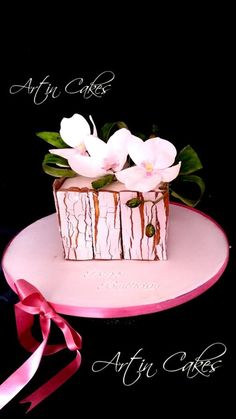 there is a small cake with flowers on it