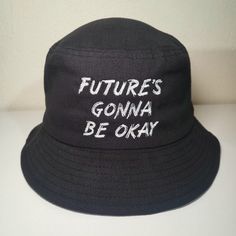 "\"FUTURE'S GONNA BE OKAY\" Agust D BTS Suga D-Day Bucket Hat Size: Standard adult; Hat circumference 22.8\" / 58cm, one size fits most  Hat comes with BTS logo on the back, as pictured, unless otherwise specified.  If interested in a different color please order through this listing: https://www.etsy.com/listing/1009827708/custom-bts-hat-choose-your-design-hat" Trendy Letter Print Bucket Hat, Trendy Streetwear Bucket Hat, Trendy Bucket Hat With Short Brim For Streetwear, Letter Print Bucket Hat, Trendy Short Brim Bucket Hat For Streetwear, Streetwear Bucket Hat With Letter Print, Trendy Streetwear Bucket Hat With Letter Print, Streetwear Bucket Hat With Flat Brim, Streetwear Bucket Hat, One Size Fits Most