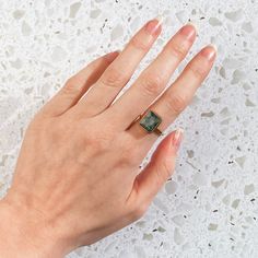 This beautiful bezel set ring is made with large rectangular faceted Aqua Chalcedony in 18K Vermeil Gold. The ring has a 925 stamp. Gemstone size is 9 x 14 mm. This ring is available in two finishes: ✦ 18K VERMEIL YELLOW GOLD ✦ 18K VERMEIL ROSE GOLD ✦ BRIGHT STERLING SILVER- - - - - - - - - - - - - - -Connect with us for new releases, sales, and giveaways!http://www.facebook.com/DaniqueJewelryhttp://www.pinterest.com/DaniqueJewelryhttp://www.instagram.com/DaniqueJewelry Gift Emerald Ring With Rectangular Stone, Aqua Chalcedony Ring, Large Drop Earrings, Gemstone Solitaire Ring, Small Drop Earrings, Bridesmaid Rings, Tourmaline Quartz, Mothers Bracelet, Chalcedony Ring