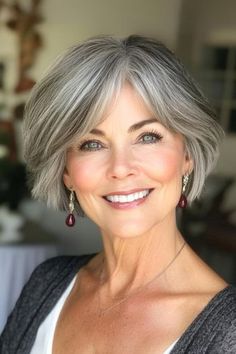 Save this pin for the best short gray hairstyles for women over 60. The layers of this ultra-short bob haircut give your strands a lift, perfect for fine hair that needs a boost. Curtain bangs soften the look and can be styled to the side or center. Bobs For Older Women Over 50 Grey Hair, French Bob Haircut Grey Hair, Short Hairstyles For Women Over 60 Gray Fine Hair Medium, Bangs Older Women, Gray Bob Hairstyles Over 50, Gray Hair Styles For Women, Hair Color For Women Over 60, Wavy Gray Hair Over 50 Bob Hairstyles, Medium Length Grey Wigs