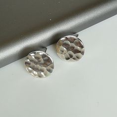 Sterling silver round ear studs with a hammered finish. Dimensions: 1.2 x 10 mm Weight: 2.1 gm Price listed is for ONE PAIR of earrings. These earrings are made of 925 hypoallergenic sterling silver. All my pieces are sent in a gift box. I can include a personal message from you if needed. You are welcome to contact me at... bhavnakwintra1956@gmail.com More hoops: https://www.etsy.com/your/shops/TheSilverGame/tools/listings/section:26305414 More earrings: https://www.etsy.com/your/shops/TheSilve Everyday Nickel-free Silver Plug Earrings, Nickel Free Silver Round Plug Earrings, Handmade Minimalist Silver Plug Earrings, Silver Plug Earrings For Everyday Wear, Nickel-free Silver Round Plug Earrings, Nickel-free Round Silver Plug Earrings, Minimalist Hammered Silver Earrings, Minimalist Silver Hammered Earrings, Elegant Silver Studs As Gift