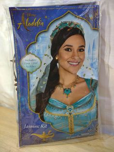 the package has an image of a woman in blue dress and tiara on it