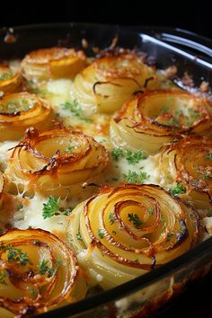 a casserole dish with onions and parsley