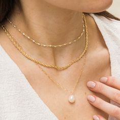 The Baroque Pearl necklace is a gorgeous addition to any look. Featuring a freshwater pearl whose shape is one of a kind (just like you!) this piece makes a sweet statement. It's perfect for all your outings, whether it's to get your morning matcha or to join your friends for a girls' night in town. Feel adorable and stylish wearing it on any occasion! DETAILS Necklace length: 18" with 2" extender 14k gold filled -or- sterling silver chain, spring clasp, & findings 10-12mm baroque freshwater pea Morning Matcha, Classic Pearl Necklace, Pearl Chain Necklace, Detailed Necklace, Bracelet Pearl, Baroque Pearl Necklace, Pearl Hoop Earrings, Summer Necklace, Matching Bracelet