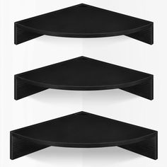 three black shelves on the wall with white background