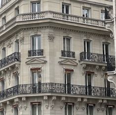 a tall building with balconies and windows