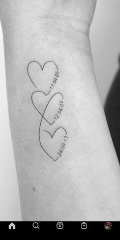 a couple of hearts with the words i love you written on their wrist tattoo design