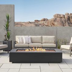 a fire pit sitting on top of a patio