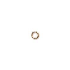 a small gold ring on a white background