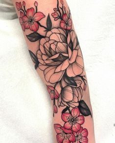 a woman's arm with flowers on it