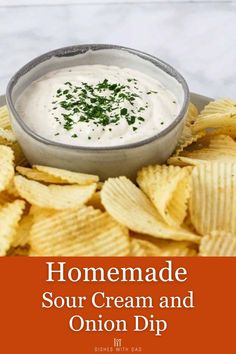 homemade sour cream and onion dip in a bowl surrounded by potato chips on a plate