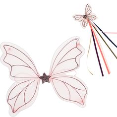 a white butterfly with pink wings and four colored sticks attached to it's back