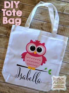 an owl tote bag with the word salella on it, sitting on a wooden table