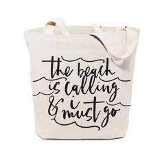 the beach is calling and i must go tote bag in white with black lettering