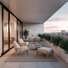 a balcony with chairs, tables and plants on it