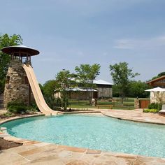 a pool with a slide in the middle