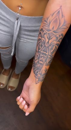 a woman with a tattoo on her arm