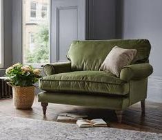 a living room filled with furniture and a large window