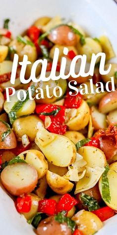 a white bowl filled with potato salad and topped with bacon, tomatoes and spinach