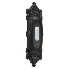 an ornate black wall mounted mirror